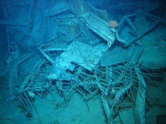Wire mesh and twisted metal in debris field